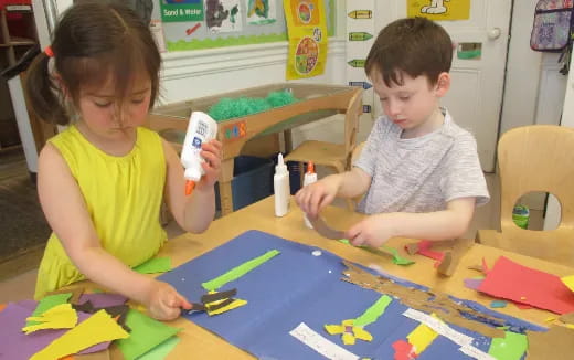a couple of children painting