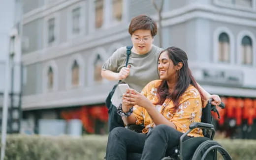a woman and a man riding a bicycle