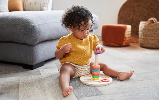 a baby playing with a toy