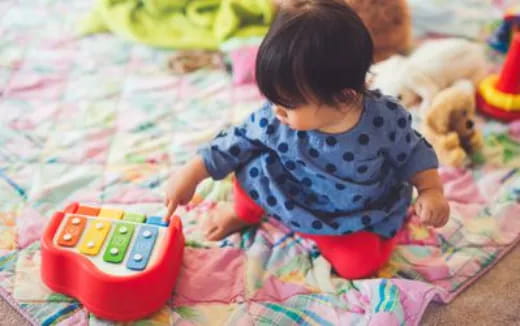 a baby playing with toys