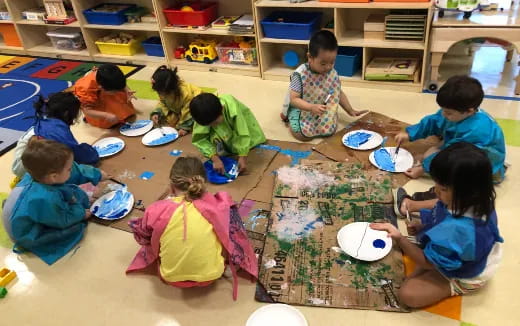 a group of children sitting on the floor