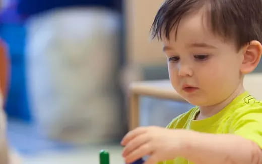 a child looking at a computer screen