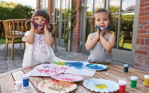 two girls eating cake
