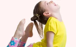 a young girl with her hands up