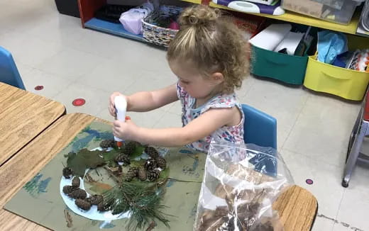 a child painting on a table