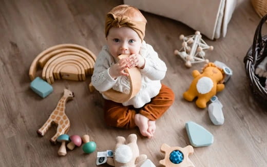 a baby sitting on the floor