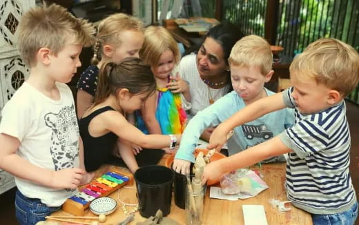 a group of children playing with a toy