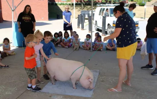 a person and a group of children