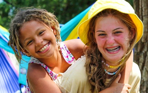 a couple of women smiling