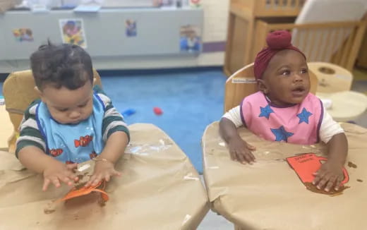 a couple of children playing with toys