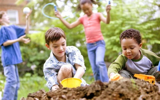 children playing in the mud