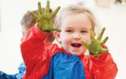 a child holding a plant