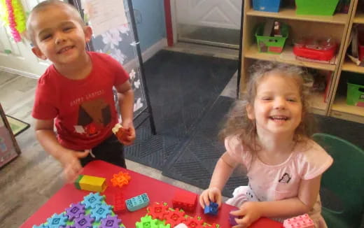 a couple of children playing with toys