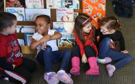 a group of children sitting on the floor