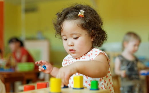 a young girl playing with toys