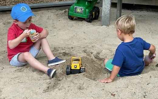 two boys playing with toys