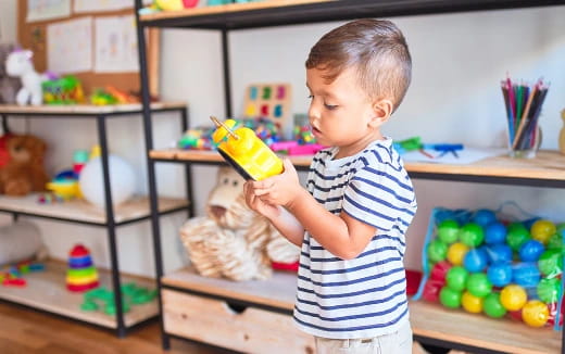 a child holding a toy