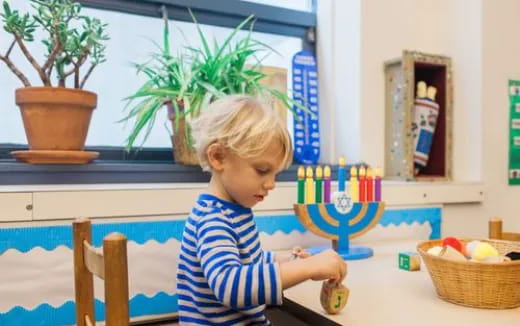 a child holding a toy