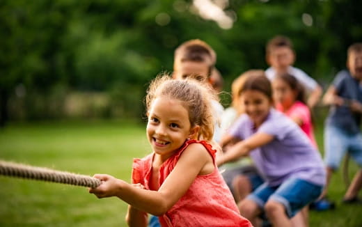 a young girl playing baseball