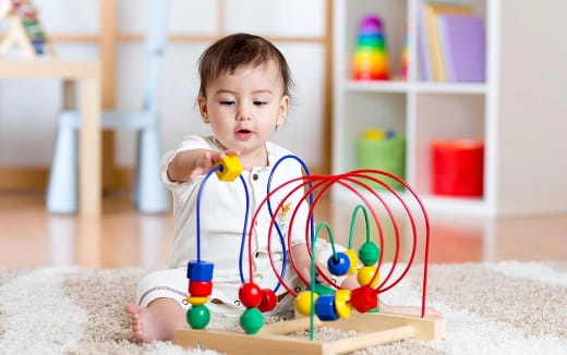 a baby playing with toys