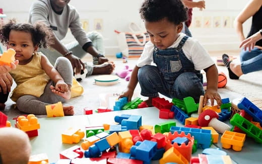 a group of children playing with toys