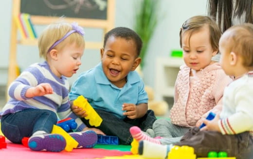a group of children sitting on the floor