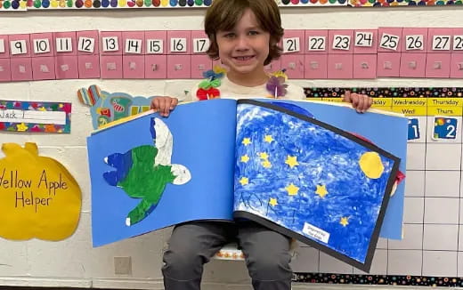a boy holding a flag