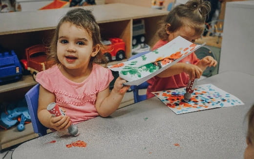 a young girl painting