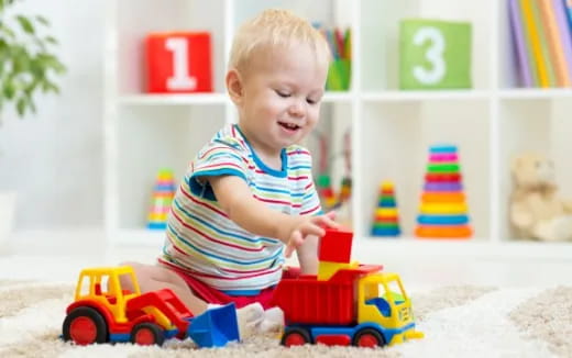 a baby playing with toys