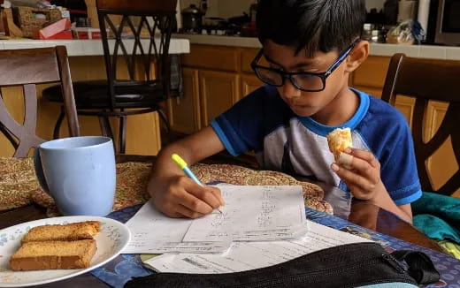 a boy eating a sandwich