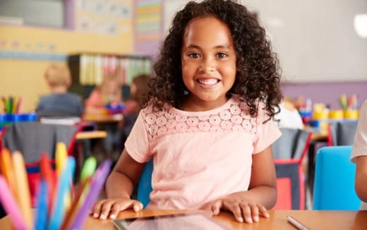 a young girl smiling
