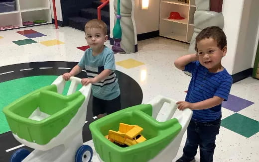 a couple of boys playing with toys