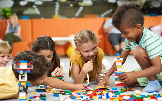 a group of children playing with toys