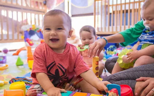 a group of children playing with toys