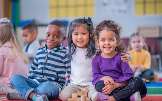 a group of children sitting on the floor