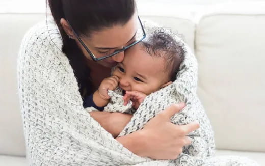 a person holding a baby