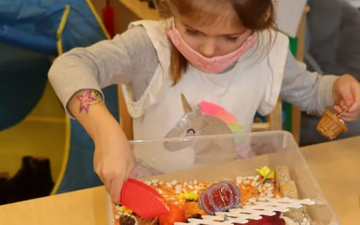 a child opening a bag of food