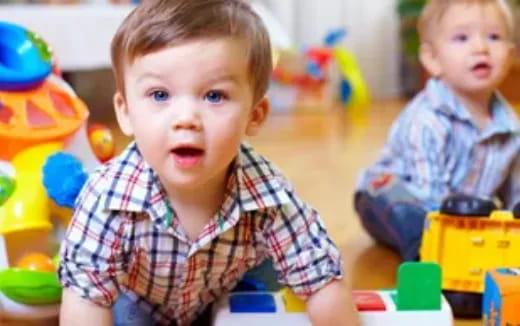a couple of children playing with toys