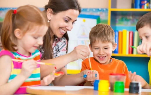 a person and children playing with toys