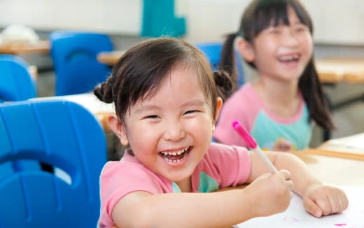 a few young girls smiling