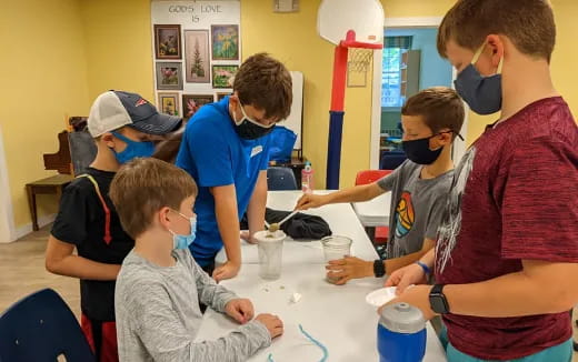 a group of people wearing masks