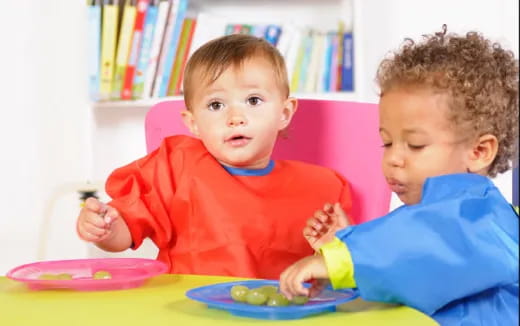 a couple of boys eating