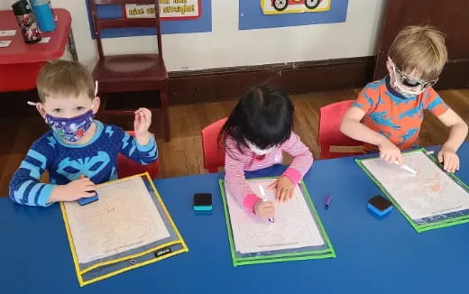 children sitting at a table