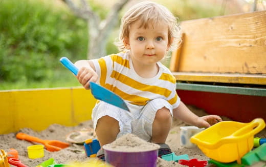 a baby playing with toys