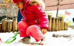 a girl in red snowboarding