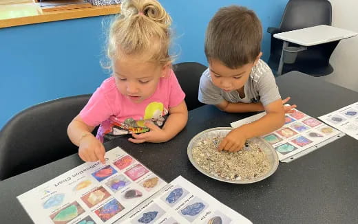 a couple of children eating