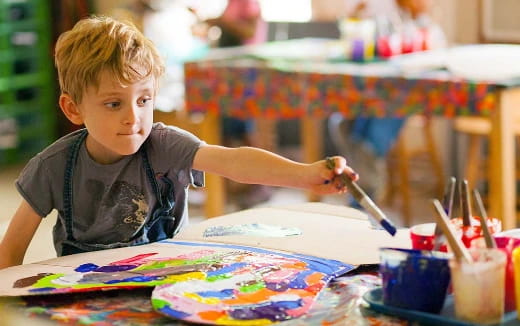 a young boy painting