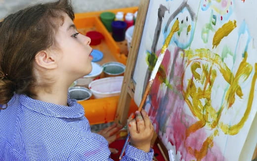 a young girl painting