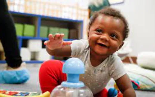 a baby with a bottle