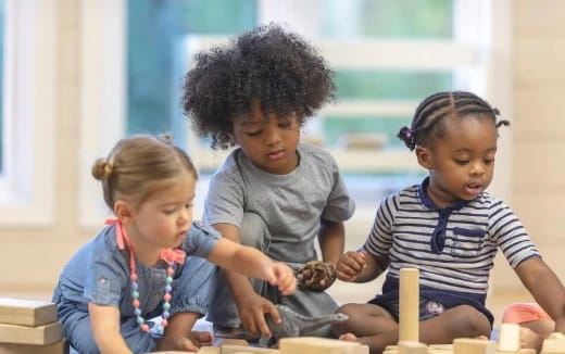 a group of children playing with a toy